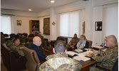 Capt MacLean attends a meeting with the Commander of the LAF Armoured Regiment.