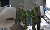 Sgt Michael Doody and Sgt Sebastien Paille cooking steaks