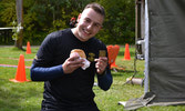 Lt Leland Kirkham rewarding himself with a cheeseburger at the finish line. Edmonton AB, Photo by MCpl M.W. Korenowski July 2016.