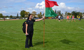 Cpl Alison Sawyer encouraging competitors at the finish line. Edmonton AB, Photo by MCpl M.W. Korenowski July 2016.