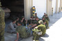 Relaxing in the rapidly disappearing shade in Baquedano, home of the 2nd Armour Brigade.