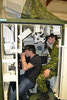 Corporal Evan Stewart and Andrew Ference in the gunnery simulators going through gunnery drills.