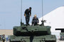 Col Cadieu and his wife Megan mount a Leopard 2 for their final departure.