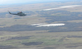 Cpl Mackenzie, 2nd Troop, provides aerial observation and overwatch to a convoy in conjunction with 408 Squadron.