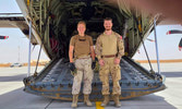 Lt Robert Haddow and Cpl Cathrine Simard stand behind their final C-130J Hercules flight, Cpl Simard extended after the end of Roto 6 to support Roto 7.