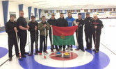 Olympic Gold Medal winner John Morris, and his father Mr. Earle Morris, pose with the Strathcona Curling Team