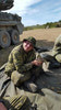 Corporal Bennan Maddison collects empty casings on the range.