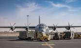 A Canadian Hercules divests its cargo on the airstrip at Camp Canada, AASAB, 17 May 22. 