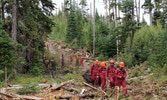 Members of 1 Sect make their way along a hose lay at Gottfriedsen Mtn. Photo by Cpl Daniel Wynen   