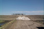 Soldier s stand on the top of the Portage Diversion, and the tons of sandbags they will soon be using to reinforce weakened areas.