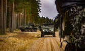 LAV 6s from Grizzly Company cover each other on the road during a long halt. Credit Sgt Felipe Barandica, Spanish Army