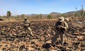 USMC and Canadian JTACs moving to occupy an OP in the Bradshaw Range and Training Area of Northern Territory, Australia