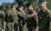 Receiving the Commander Task Force Latvia Commendation...