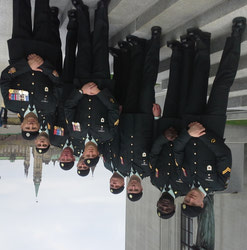 (From L to R) - Cpl Partington, Cpl Kabongo, Cpl Morin, Cpl Young, Cpl Langlands, Sgt Williams, Cpl Popoff, CWO Crabb, outside the Supreme Court of Canada with the Peace Tower in the background.
