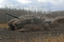 A Leopard 2 A4M making its way in haste to secure an attack position.
