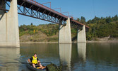 Capt Gord “almost there” Elliott passing under one of the ten bridges that span the canoe portion of the North Saskatchewan River.