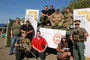 On top of the LAV, left to right: Capt Tams, Cpl Dunford, Cpl Wagner and Cpl Phelan On the Ground, left to right: Joe, Scott Collacutt, Kevin, Martin from Valour Place (in the red shirt), Val (holding the pistol) and Stewart (in peaked cap).