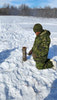 Cpl Steeves making a fire during Winter Survival Training. 