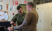 Tack Master Cpl Ford teaches Tpr Adey how to break down stirrups