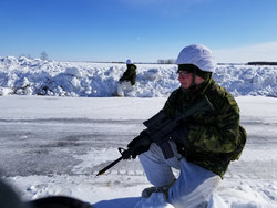 Tpr Sean “Stone Cold” Williamson keeps a watchful eye across the windblown fields for enemy insurgents