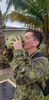 Capt Giajnorio enjoying a coconut in BATSUB (British Army Training Support Unit Belize) 