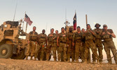 Lt Haddow takes poses with a USAF security forces flight after conducting a patrol through Al Anbar Province