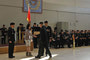 Pte Comeau shaking the hand of Mrs. Jocelyn Steeves.  MWO Holland (left) and Maj McLaughlan (right) also present.